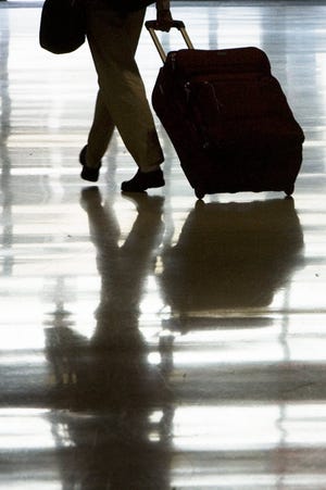 Airlines have sought to increase revenue through charges such as luggage 
fees.AP ARCHIVE