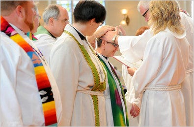 The Rev. Sharon Stalkfleet, center, was one of seven gay pastors at a welcoming ceremony Sunday at St. Mark’s Lutheran Church in San Francisco.