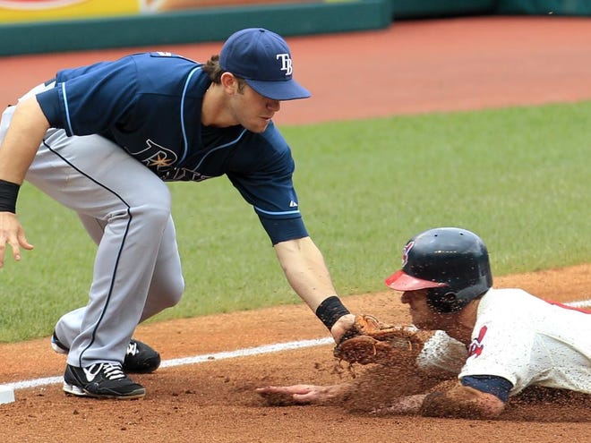 Rays third baseman Evan Longoria, left, tags out the Indians' Jayson Nix at third in the second inning Sunday.