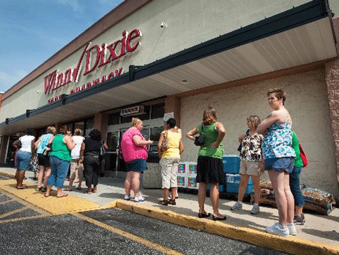 Local expecting military mothers wait outside a Winn-Dixie off Atlantic Boulevard to receive free baby goods as part of the Military Mommy Diaper Dash July 12, 2010. Today, just more than two weeks later, Winn-Dixie announced it will close 30 of its 514 stores, including one in Jacksonville, and cut 120 jobs in its corporate and field support staffs as it deals with a continued weak economy.