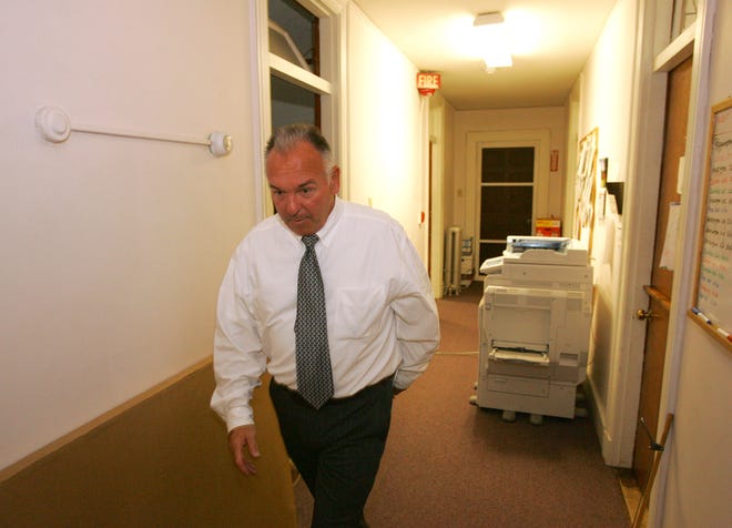 Michael Flaherty leaves a meeting of the Weymouth Housing Authority Board of Commissioners held in executive session on Tuesday, July 6, 2010, in Weymouth.