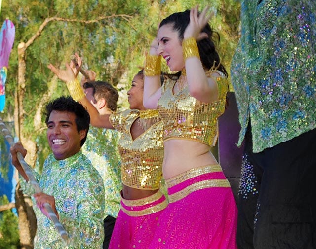 Fernando Casas, far left, dances during a show at Disney's California Adventure Theme Park. Casas dances during a Bollywood dance that features Indian dance and costume.