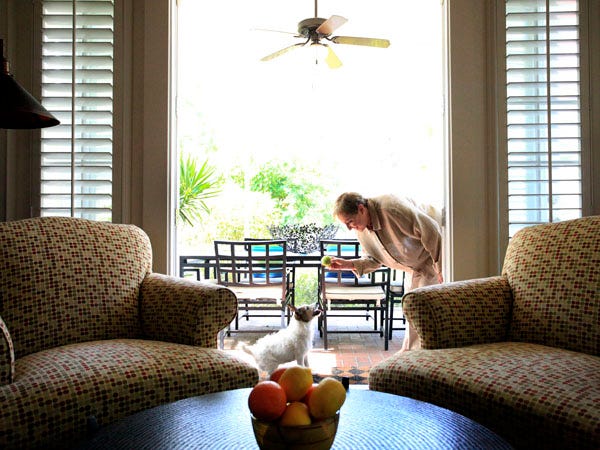 Michele Conte has several porches surrounding her home in Town of Tioga, including the screened dining porch extending from her living room, shown Thursday, July 22, 2010, in Gainesville.