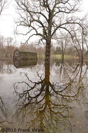 Frank Vitale won "Best in Show" for adult entries in the Sudbury Valley Trustees' photo contest for this shot of the
Old Manse in Concord during last spring's floods.
