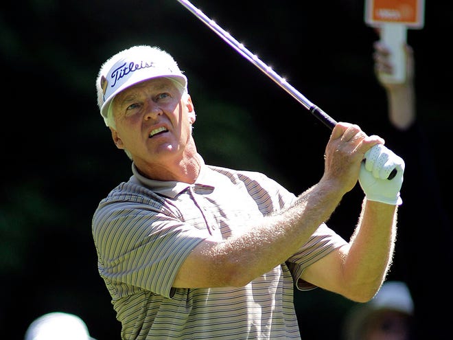Sun glints off the club of Bruce Vaughan, of Hutchinson, Kan., as he hits off the ninth tee in the first round of the U.S Senior Open golf tournament Thursday, July 29, 2010, at Sahalee Country Club in Sammamish, Wash., near Seattle. Vaughan, who started on the 10th tee, finished four under par. (AP Photo/Ted S. Warren)