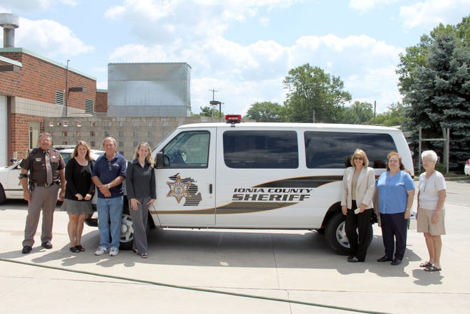 Members of the Ionia County Community Corrections Advisory Board are with the newly acquired work van that is used to transport inmates and those serving community serve to areas where they pick up trash, set-up at local blood drives and other meet other needs in the community.