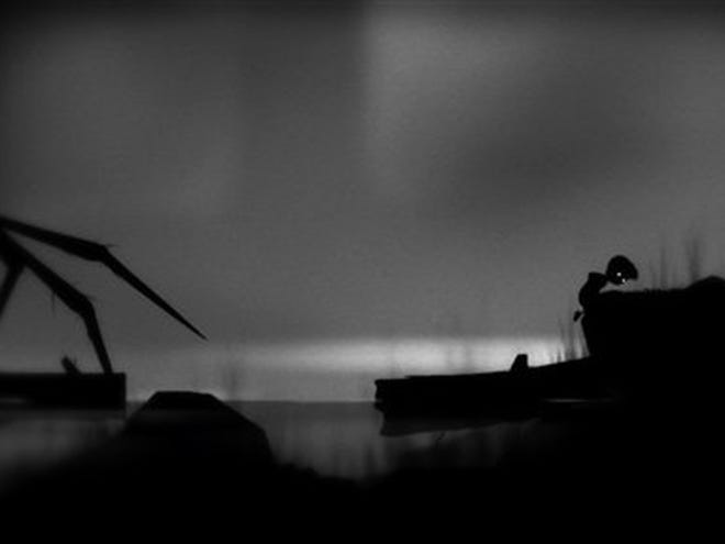 In this video game image released by Playdead, a boy explores a haunted black-and-white world in a scene from "Limbo".
