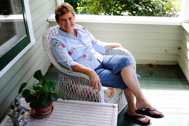 Barbara Shaw relaxes on the front porch of her home on West Stewart Road. Shaw says she has noticed a difference using her front porch. “I know more people in this neighborhood than any other one I’ve ever been in,” she said.