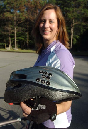 Jennifer Kovalich will ride in the Pan-Mass Challenge iin memory of her father, who died of cancer. On her bicycle helmet reads "for my dad."