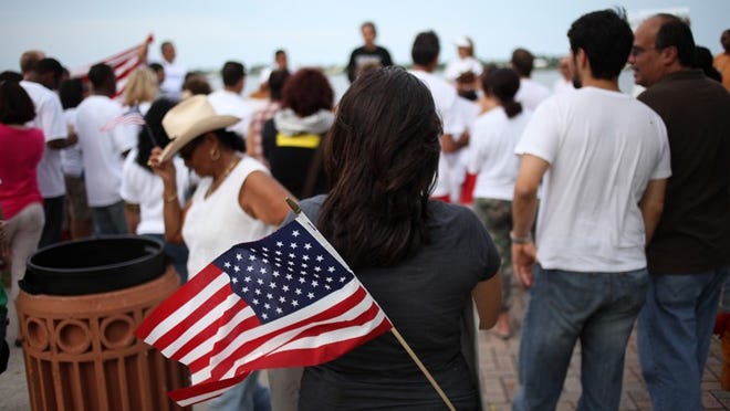 The rally was organized by Palm Beach County Coalition for Immigrant Rights with similar events taking place across the country as an act of solidarity in what has been named the 'National Week Against Criminalization.'