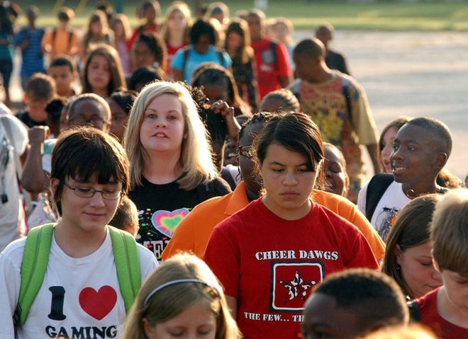 Sixth-graders head to their homerooms on the opening day of classes at Waycross Middle School in Georgia.