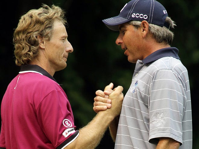 Bernhard Langer, left, of Germany, talks with runner-up Fred Couples after Langer won the U.S. Senior Open golf tournament Sunday, Aug. 1, 2010, at Sahalee Country Club in Sammamish, Wash. (AP Photo/Ted S. Warren)