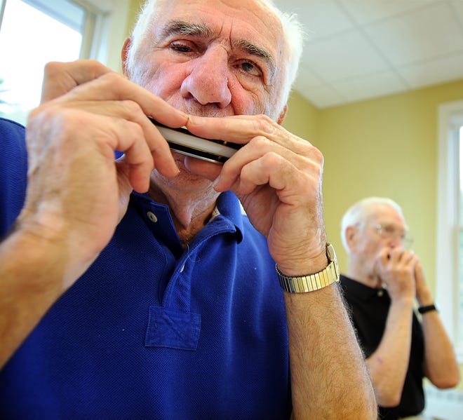 Ray Salvo finishes his solo on Beethoven's "Ode to Joy" as Ernie Youngdahl, background, and the club join in. The Harmonica Club at the Northborough Senior Center, which meets every Monday, was practicing for their Aug. 12 performance at the center's Men's Club breakfast.