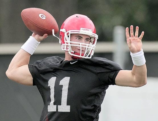 Georgia quarterback Aaron Murray throws a pass on the first day of practice Monday in Athens. By CURTIS COMPTON, Atlanta Journal-Constitution