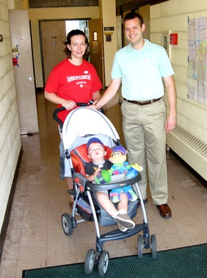 Melissa and Ryan Vincent wheeled son Carter, 16 months, out of First Congregational Church after they voted about 8 a.m. Tuesday.