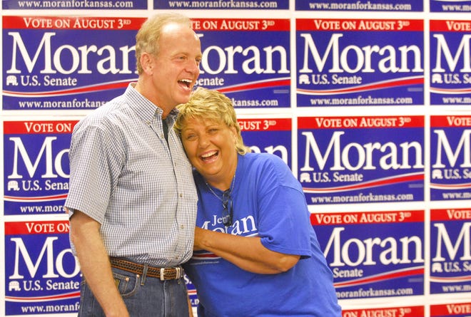 Rep. Jerry Moran, R-Hays, a U.S. Senate hopeful, left, shares a moment at his campaign headquarters with one of his Plainville High School classmates, Bonnie Staab, during a campaign rally on Tuesday, Aug. 3, 2010, in Hays, Kansas. (AP PH