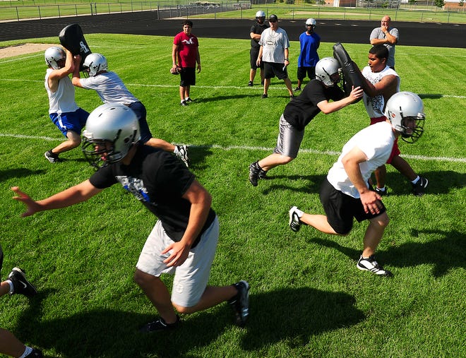 File/The Holland Sentinel 
Prep football practices begin for varsity, junior varsity and freshmen teams Monday across the state.