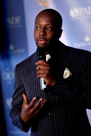 This May 20, 2008 file photo shows Wyclef Jean speaking during a news conference in New York. The former head of Haiti's Chamber of Deputies says singer Wyclef Jean is about to announce his candidacy for president of a nation struggling to recover from the Jan. 12 earthquake.