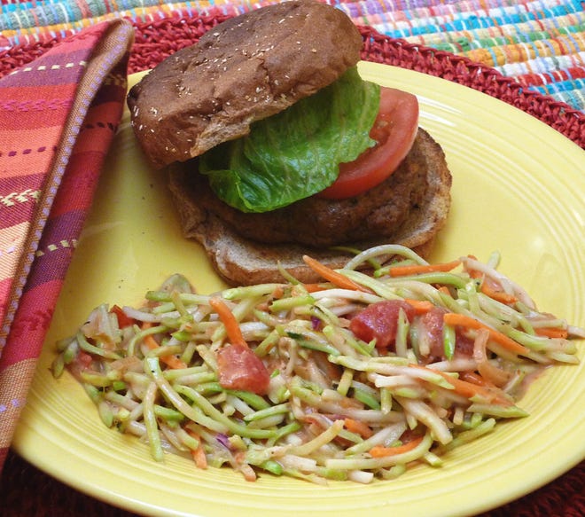 Hamburgers with a touch of Southwestern spices and a simple homemade slaw make a quick All-American dinner. (MCT)
