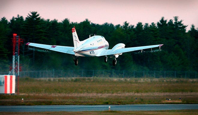 A plane takes off from Plymouth Airport in August 2006 to spray the pesticide Anvil over southeastern Massachusetts to battle EEE, a virus carried by mosquitoes that is often fatal to humans. Nozzles beneath wings spray the pesticide.