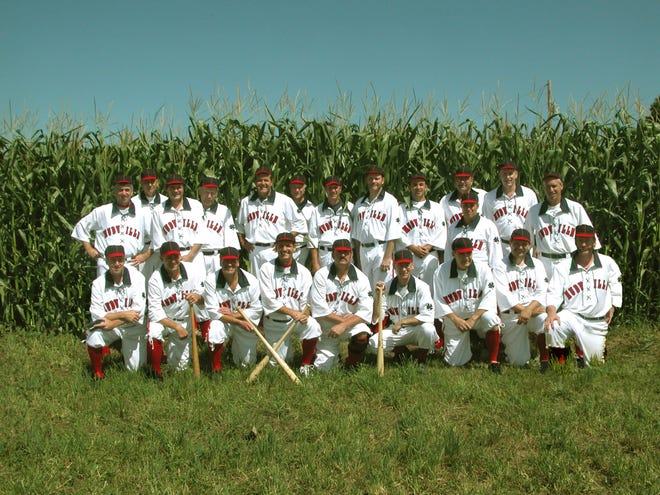 Members of the Mudville Base Ball Club of Holliston poses in front of a cornfield just north of Cooperstown, N.Y.