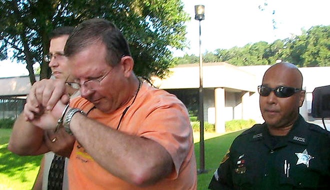 Thomas Michael Brown, 59, a teacher at Forest High, was charged Wednesday with solicitation of a child using the Internet, transmission of obscene or harmful material to a minor and simple battery.