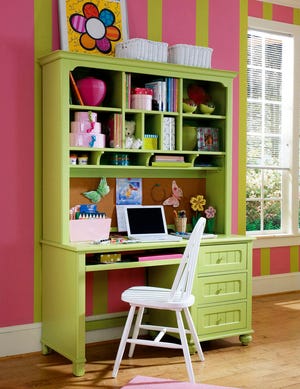 This photo provided by Northwest Arm Press shows a desk with hutch from Lea Furniture's Freetime Collection as seen in "Right-Sizing Your Home, " by Gale Stevens. While homework space must be functional and well organized, it also should be somewhere the child wants to spend time.