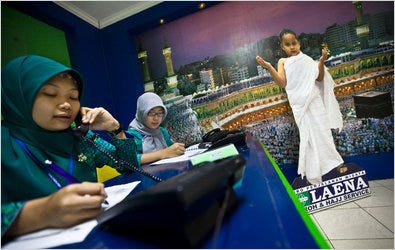 Employees at a travel agency in Jakarta that specializes in Hajj pilgrimage packages. About 1.2 million Indonesians are on a waiting list to travel to Mecca.