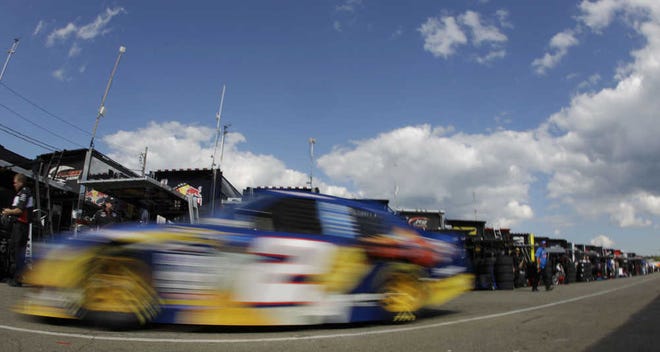 Kurt Busch drives out of the garage area during practice for the NASCAR Sprint Cup Series' Heluva Good! Sour Cream Dips at The Glen auto race in Watkins Glen, N.Y., Friday, Aug. 6, 2010. (AP Photo/ David Duprey)