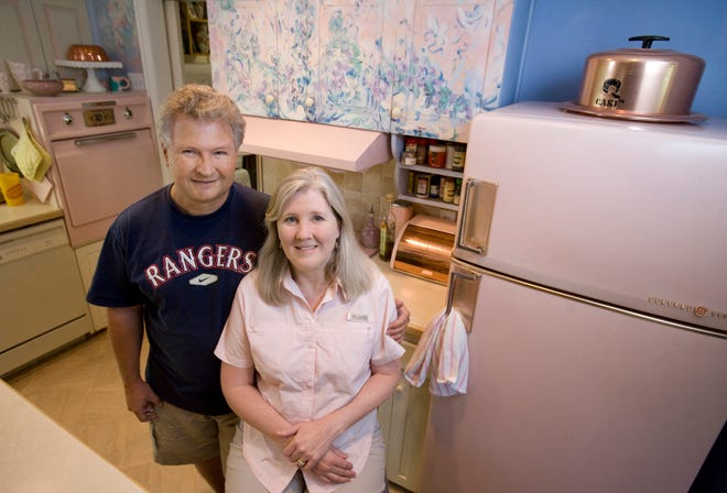 Lee, left, and Melissa Higginbotham own a working vintage 1956-57 GE Refrigerator and a GE stove and oven. They also own other vintage kitchen items ranging from a cake carrier to canisters.