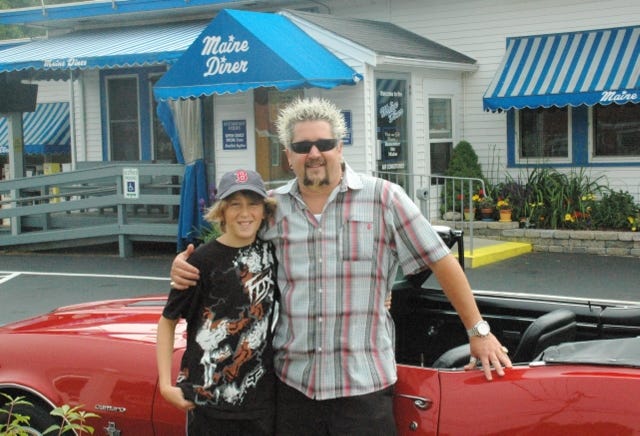 Guy Fiere of "Diners, Drive-ins and Dives" poses with his son in front of the Maine Diner in Wells.