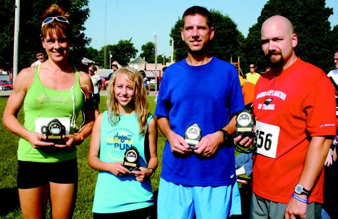 The top Toulon runners in Saturday’s Indian Creek 5K?were, from left, Kim Becker, female runner-up; Kyra DeSchepper, female champion; Evan Sulaski, male champion; and Matt Shipp, male runner-up. The top overall male and female runners appear on page B2.