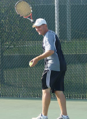 Metamora Township High School boys tennis coach Kelly Willard has led the Redbirds to four straight Sectional titles.