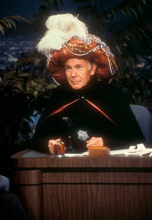 In this undated photo provided by NBC, Johnny Carson begins an episode of the "Tonight Show" as "Carnac, The Magnificent!" (NBC, Chris Haston, The Associated Press file photo)