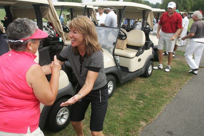 State Rep. Karyn Polito, right, greets Debbie Capalbo of Shrewsbury with a hug before the start of Monday's annual Karyn Polito Charity Golf Tournament at Pleasant Valley Country Club in Sutton.