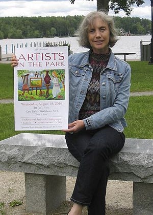 Dawn Marion displays the Artists in the Park poster she designed.