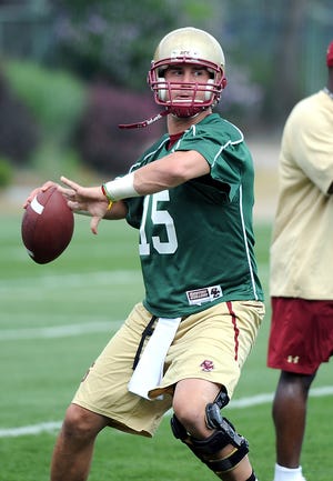 Boston College quarterback Dave Shinskie throws a pass during the team's opening practice of fall camp on Monday.