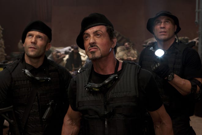 From left, Jason Statham, Sylvester Stallone and Randy Couture are shown in a scene from "The Expendables."