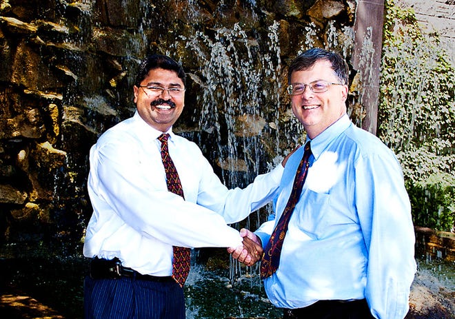 Cambridge Telcom, inc. purchased Global Medical Informatics (GMI), formerly known as New Century Global Solutions, LLC. The full service health information mangement firm is based in Bettendorf, Iowa. Pictured are Shirish Tangirala, manager of the operation, and Scott Rubin, president of Cambridge Telcom, Inc.