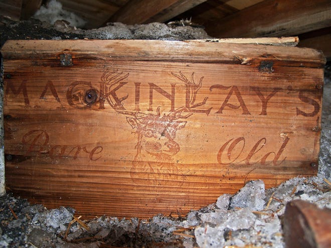 In this undated photo provided by Antarctic Heritage Trust via the Canterbury Museum, a whisky crate is stored beneath the floor of a hut built by British explorer Sir Ernest Shackleton during his 1908 Antarctic expedition. The crate of Scotch whisky that has been frozen in Antarctic ice for more than a century is being slowly thawed by New Zealand museum officials, for analysis not to be tasted. (AP Photo/Antarctic Heritage Trust via the Canterbury Museum, Paul Terry) **Editorial Use Only**