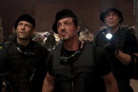 In this film publicity image released by Lionsgate Entertainment, from left, Jason Statham, Sylvester Stallone and Randy Couture are shown in a scene from "The Expendables." (AP Photo/Lionsgate Entertainment, Karen Ballard)