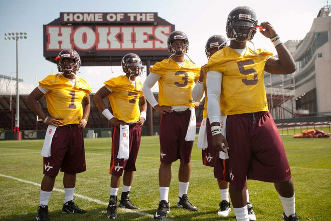 From right to left, Virginia quarterbacks Tyrod Taylor (5), Logan Thomas (3), Ricardo Young (7) and Mark Leal (1) look on during their season's first NCAA college football practice in Blacksburg, Va., Friday, Aug. 6, 2010. (AP Photo/The Roanoke Times,Justin Cook)