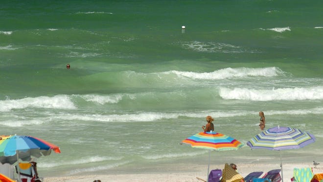 A small rip current is visible as lighter-colored water, center, at Holmes Beach on Anna Maria Island on Friday. Two beachgoers died Thursday after being caught in rip currents on the unguarded, and less crowded, northern tip of the island.