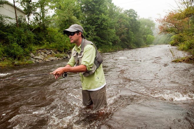 Lawton Weber of northern Vermont fishes at the Gihon River near where he 
found didymo, noxious algae, this year. Scientific evidence suggests that 
felt, which on the soles of boots helps anglers stay upright on slick rocks, 
is also a vehicle for microorganisms that can disrupt freshwater 
ecosystems.NEW YORK TIMES / CALEB KENNA