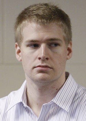 In this June 22, 2009 file photo, former Boston University medical student Philip Markoff stands during his arraignment in Suffolk Superior Court in Boston, on charges he killed a masseuse at a Boston hotel that he met through Craigslist. Officials confirmed that Markoff was found dead of apparent suicide in his jail cell Sunday, Aug. 15, 2010 in Boston.