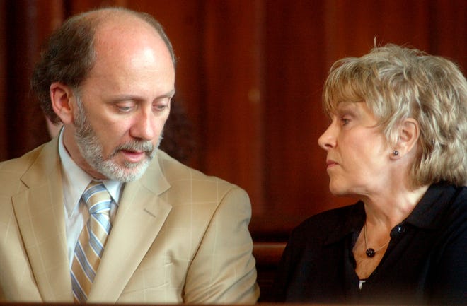 Former state Senator James Marzilli, left, is seen here talking with his wife, Susan Shaer.