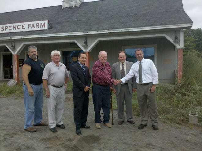 Celebrating the sale are, left to right, Paul Medeiros, member of the Agriculture Committee researching the best use of the farm stand and land; Mark Gaffney, Ward 3 Alderman; Mike Anderson, Ward 4 Alderman; Albert “Bud” Spence; Rick Murphy, Spence Attorney; and Mayor Scott D. Galvin.