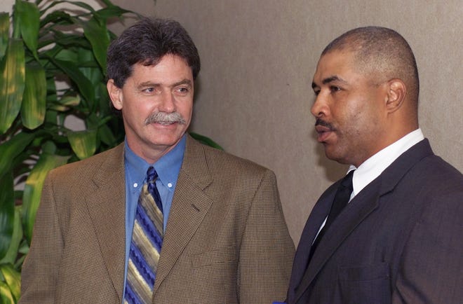Current Brewers general manager Doug Melvin, left, was the Texas Rangers' general manager from 1994-2001. Here he talks with former RedHawks manager DeMarlo Hale. Photo by The Oklahoman Archive