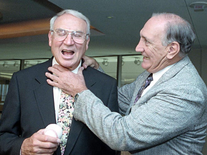 This Oct. 3, 1991, file photo shows former Brooklyn Dodgers baseball player Ralph Branca, right, pretending to choke former New York Giants player Bobby Thomson, on the 40th anniversary of Thomson's Oct. 3, 1951 ninth inning homer off Branco to win the National League pennant, in New York. Famed home run hitter Bobby Thomson died Monday night. He was 86.