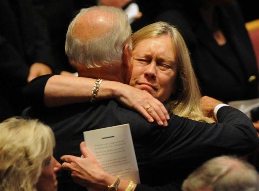 Vice President Joe Biden embraces Catherine Stevens after he spoke during her husband's funeral service at the Anchorage Baptist Temple in Anchorage on Wednesday.(AP Photo/Erik Hill - Anchorage Daily News)